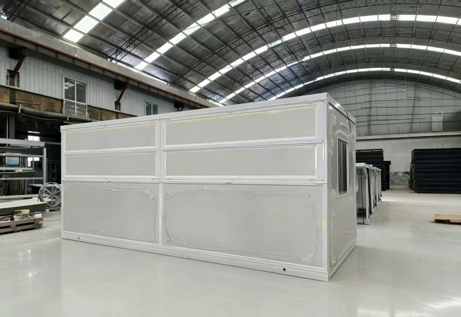 White-panel folding container house in factory